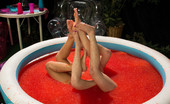  80149 Foot Worship 2 sexy girls get dominated by hot blonde in a pool of jello making them worship feet and get double footed in their pussies!
