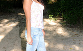  81295 Shyla Jennings pulls down her jeans and fingers her tight pink pussy in the park