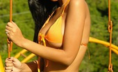  81892 Karla Spice gets naughty and playful at the playground in her orange bikini
