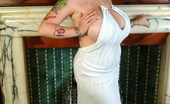 Dors Feline 87600 Shows Off Her Massive Boobs In A White Dress