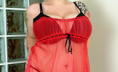 Dors Feline 87606 Shows Off Her Massive Boobs In A Red Mesh Dress
