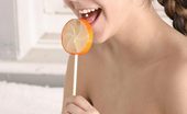 Andi Pink 104411 Teen amateur licks an orange pop!
