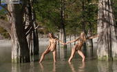 Amour Angels Natasha And Anna ANNA & NATASHA 105763 Amazing view of the trees and warm water make these cute lesbian girls remove clothes and start posing.