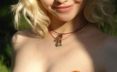 Amour Angels Ashlyn ASHLYN SUNSHINE 105918 Blonde in a straw bonnet taking off her orange dress and stockings to walk around naked