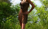 Amour Angels Valeri BLONDE VALERY 105997 Charming blond is standing in the forest near a lake and looks like a real lioness in leopard dress, which the angel slowly take