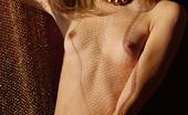 Amour Angels Anna SUNSET 106024 Fully nude killing blonde angel shows all wonderful treasures without any shade of shame in red bedroom.