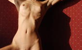 Amour Angels Anna SUNSET 106024 Fully nude killing blonde angel shows all wonderful treasures without any shade of shame in red bedroom.