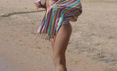 Amour Angels Alizeya SEABOARD 106039 Incredible astounding nude beauty is lying in the water at the seaside and gaily smiles in the objective of the camera.