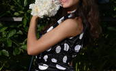 Amour Angels Albina SMILING 106078 Astonishing indescribable angel has taken off her big bonnet and polka dot black dress to pet her pussy and tits with big white flowers.