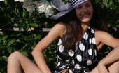 Amour Angels Albina SMILING 106078 Astonishing indescribable angel has taken off her big bonnet and polka dot black dress to pet her pussy and tits with big white flowers.