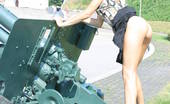 Amour Angels Sveta MILITARY 106091 Gorgeous cheeky angel is wearing military clothes and poses near grenade launcher, tank and different army airplanes.