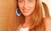 Amour Angels Katya LOVELY NEIGHBOUR 106229 Fascinating blue-eyed teen undresses just in her room near brown wardrobe and is burning from desire to rub her pretty beaver.