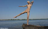 Amour Angels Sveta LOLLIPOP 106297 Nothing in the world can be compared with this nude attractive beauty as she is posing on the rocks of the blue river.