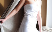 Amour Angels Indi SHADOW 106324 Beautiful girl cannot keep from posing in white dress and showing all.