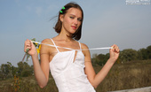 Amour Angels Alina ROMANTIC STORY 106334 In no time teenie removes dress and panties to pose naked outdoors.