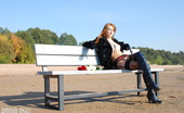 Amour Angels Kristina NUDIST 106354 Girl in black coat and sexy high-heel boots poses on the bench now.