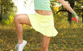 Amour Angels Alina EROTIC SPORT 106403 Slim teen girl takes off green top, yellow skirt and white panties.