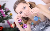 Amour Angels Meseda ELKA 106490 Lovely pigtailed teenage cutie lounges naked by the New Years tree exposing her assets.