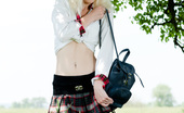 Amour Angels Snejana COLLEGE GIRL 106586 Pretty white skinned blonde teen in white stockings and plaid skirt getting naked outside.