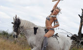 Amour Angels Sunna ANCIENT 106647 Petite girl dressed up as an Indian rides a horse and lets you peek under her loincloth.
