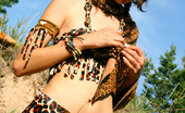 Amour Angels Anfisa MAYA 106735 Gorgeous teen girl dressed up in exotic outfit shows off her sweet naked body outdoors.