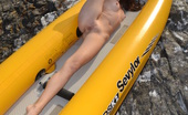 Amour Angels Alexa KAYAK 106810 Wonderful long haired girl taking off swimsuit and showing shaved pussy in a yellow boat.