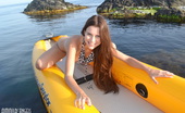 Amour Angels Alexa KAYAK 106812 Incredible long haired teen beautie showing hot tits, sweet pussy and round ass in a boat.