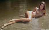 Amour Angels Kristina SUNNY GIRL 106820 Incredible teen with perfect tits and tight ass posing in the river and on a sandy beach.