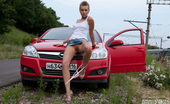 Amour Angels Karry CHIC 106837 Gorgeous short haired teen beauty stripping and spreading legs outdoor near the red car.