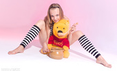 Amour Angels Dana HUNNY POT 106870 Wonderful teen beauty in striped gaiters with a teddy bear undressing and spreading legs.
