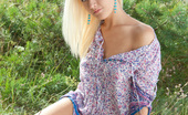 Amour Angels Karina KARINA 106898 Remarkable blonde teen model stripping clothes and spreading legs outdoor on the nature.