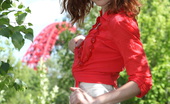 Amour Angels Agness RED SHINE 106921 Remarkable redhead teen charmer stripping and demonstrating pussy outdoor on the nature.