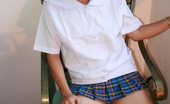 LBFM 108661 Horny college student lifting her mini school skirt to finger her bald slit
