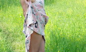 LBFM 108735 Noon doesn't wear any panties and she lifts her dress outdoors to show her assets
