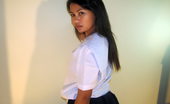 LBFM 108757 Shy college student lifting her school skirt to show her hairless slit
