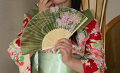 LBFM 109381 This young Geisha gives a good service to her foreign guest
