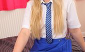 Only Tease Natalie Grant 109575 Naughty blonde college girl slips out of her college uniform.
