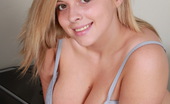 Tegan Brady 111295 Busty Blonde Poses In Her Mini Skirt And Pink Shirt Before Stripping To Her Panties
