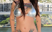 Emma Ink 111704 In Silver Bikini Masturbating On Railing
