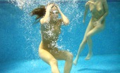 Club Seventeen Malvina And Silvia 114068 Horny cuties swimming with large blow up dolls in a pool
