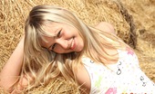 Club Seventeen Tracy Delicious 114256 Cute teenage girl masturbating outside in a pile of hay

