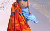 Club Seventeen 116342 Beautiful teenie shows her shaved snatch at the beach
