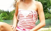 Club Seventeen 116832 Tiny brunette teenage girl showing her small boobies outdoor
