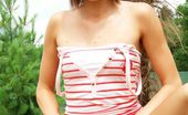 Club Seventeen 116832 Tiny brunette teenage girl showing her small boobies outdoor

