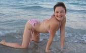 Christine Young Amazing teen Christine Young flashing her tits on the beach
