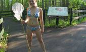 Christine Young 121793 Blonde cutie flashing her boobs and having fun outdoors
