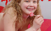 Christine Young 121800 Pretty teen girl Christine Young posing with a lollypop
