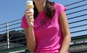 Chloe 18 158970 Burnette teen licking ice cream at the park