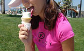 Chloe 18 158970 Burnette teen licking ice cream at the park