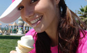 Chloe 18 158970 Burnette teen licking ice cream at the park